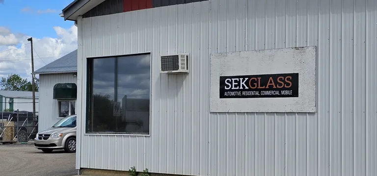SEK Glass sign on the side of the shop